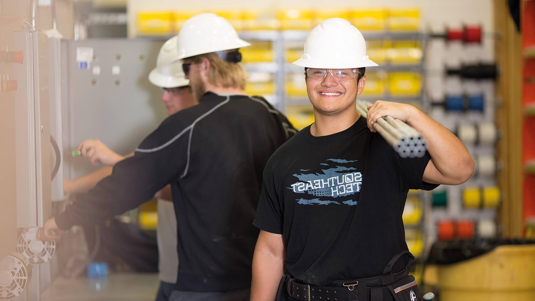 Student on construction site with pipes